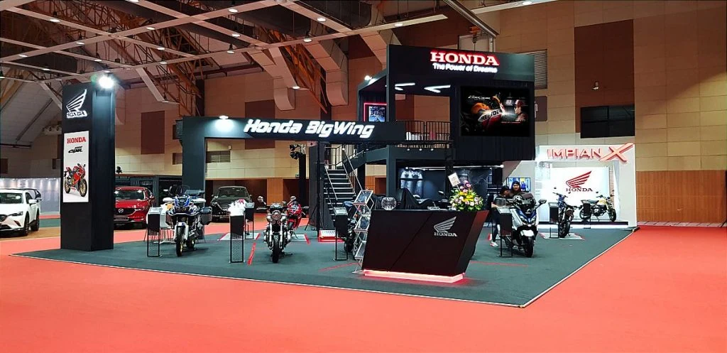 Honda BigWing booth showcasing a motorcycle at a Malaysian autoshow, highlighting a large exhibition setup.