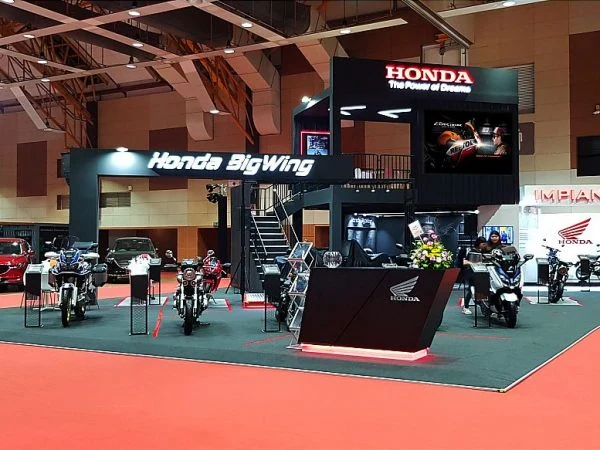 Honda BigWing booth showcasing a motorcycle at a Malaysian autoshow, highlighting a large exhibition setup.