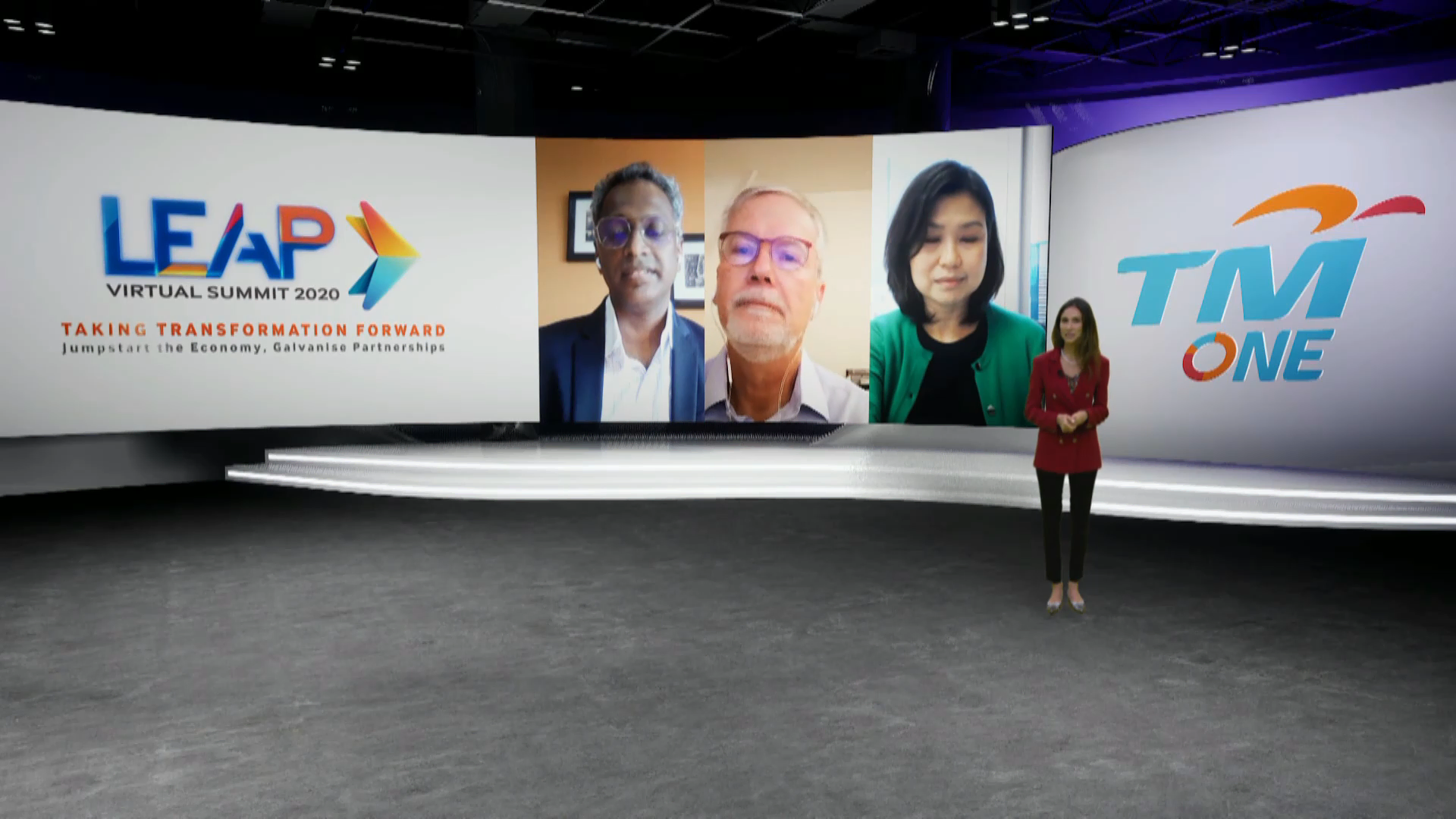 During the LEAP Virtual Summit 2020, a host converses on a television screen with three panels present in a virtual event organized by Moonman Events sdn bhd.